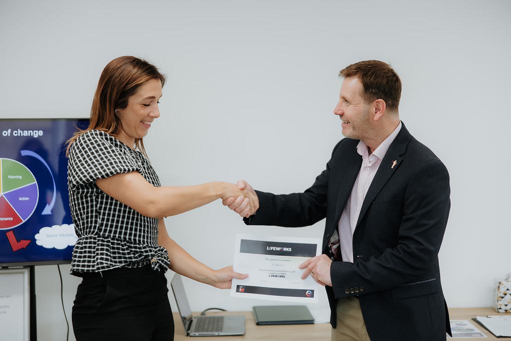 Spouse of a veteran being presented Lifeworks programme certificate