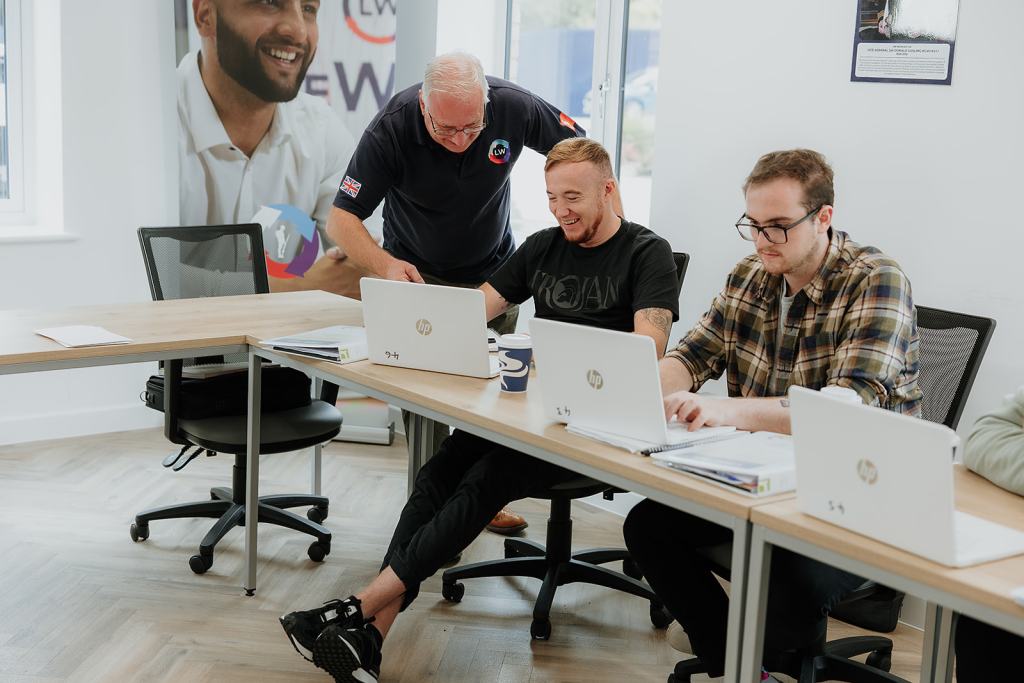Lifeworks tutor and veteran giving one to one support to two veterans